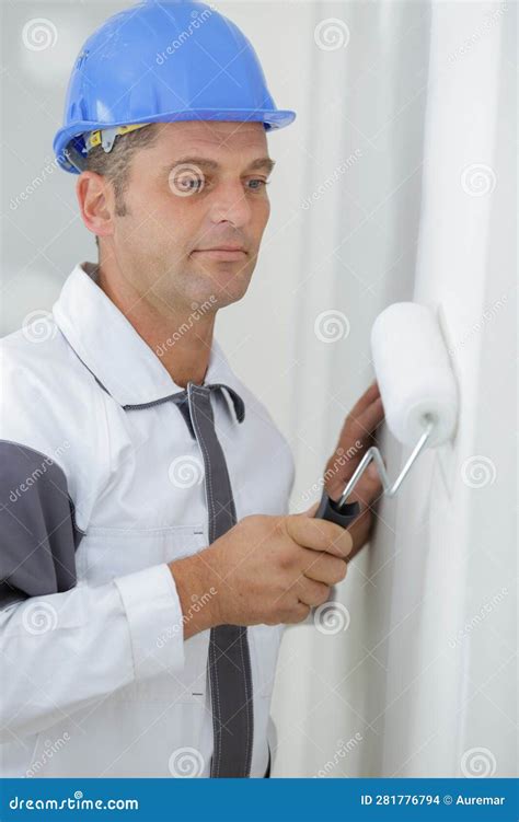 Male Painter Using Roller On Wall Stock Photo Image Of Repair