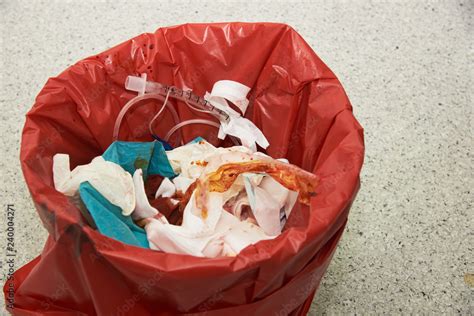 Used Endotracheal Tube Surgical Gloves Stained With Blood In A Red