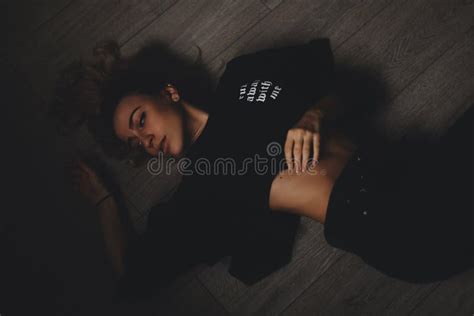 Attractive Woman Lies On The Floor She Looks Sensuality Hot Girl Wears Total Black Look Stock
