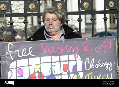 Russian Activist Holds Placard Reads Free Pussy Riot Written Both In English And Russian On