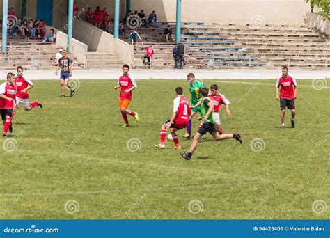 Two Amateur Football Teams Play On The Field In Editorial Photo Image