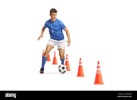 football player running  leading  ball  training cones
