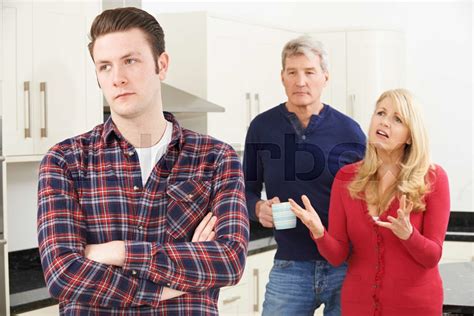 Mature Parents Frustrated With Adult Son Living At Home Stock Image Colourbox