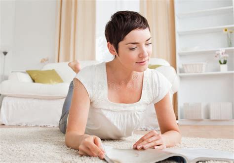 Cute Brunette Reading A Magazine Stock Photo Image Of Happy Female