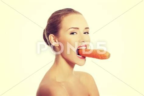 Portrait Of Nude Woman Eating A Carrot Stock Photos AD Woman Nude Portrait Eating Nude