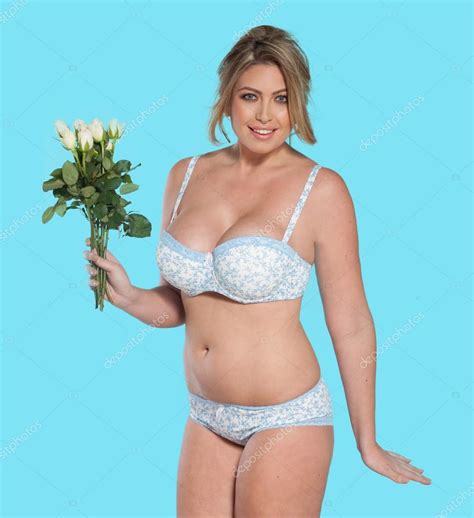 Woman In Lingerie Carrying Flowers Stock Photo By Nelka