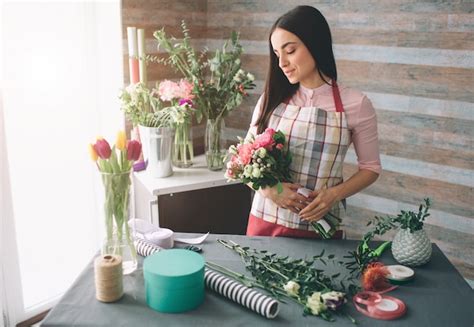 Premium Photo Female Florist At Work Pretty Young Dark Haired Woman