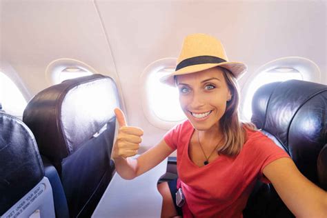 Travel And Technology Young Woman In Plane Taking Selfie While Sitting