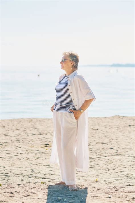 Outdoor Portrait Of Happy And Healthy Mature Year Old Woman