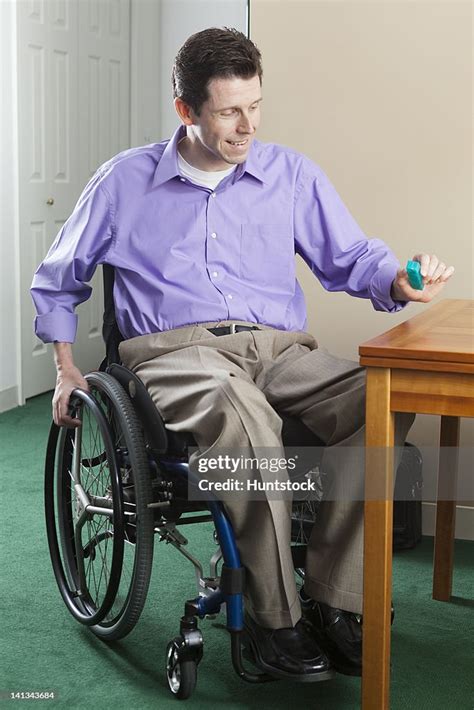 Quadriplegic Man In Wheelchair With Spinal Cord Injury Opening Pill ...