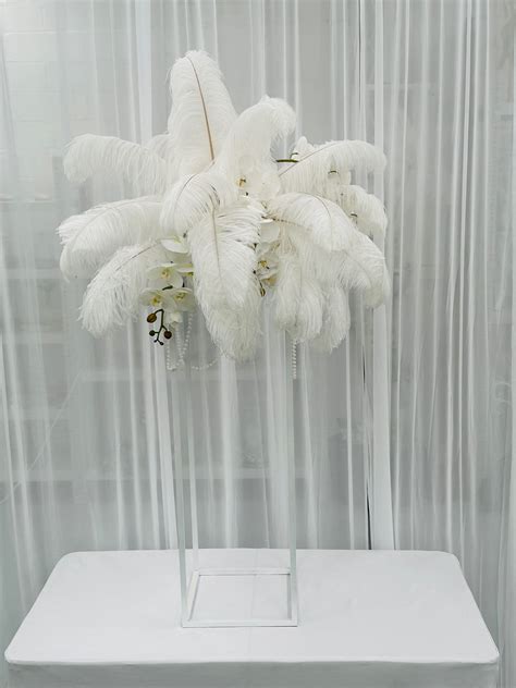 Ostrich feather and orchid arrangement - Weddings of Distinction - Hire