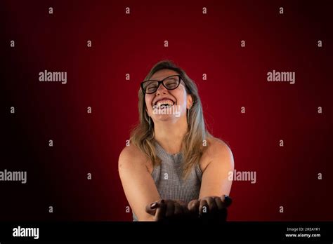 Portrait Of Beautiful Mature Woman Confident And Smiling Positive Person Isolated On Red