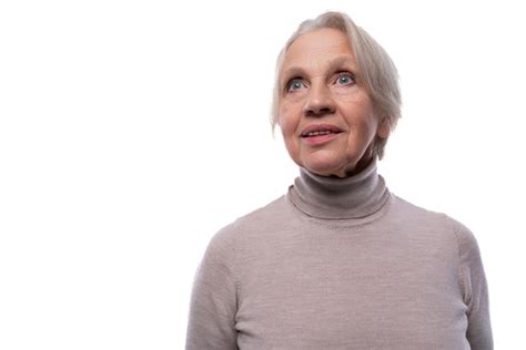 Premium Photo A Mature Woman With Gray Hair Is Daydreaming And Looking Up