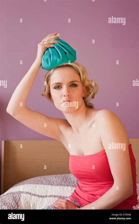 Woman With Hot Water Bottle Stock Photo Alamy