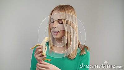 Close Of Blond Woman Eating Banana Portrait Of Blonde Girl Biting Ripe Fruit Stock Video