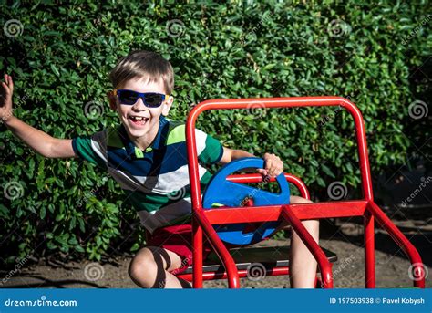 Little Boy Driving Big Toy Car and Having Fun, Outdoors Stock Photo ...