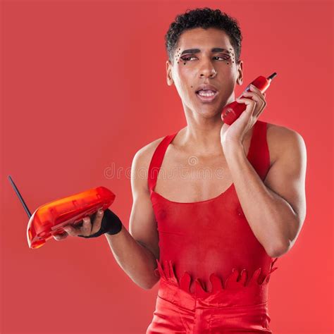 Phone Call Beauty And Gay Man Talking With A Sassy Attitude And Red Outfit In A Studio