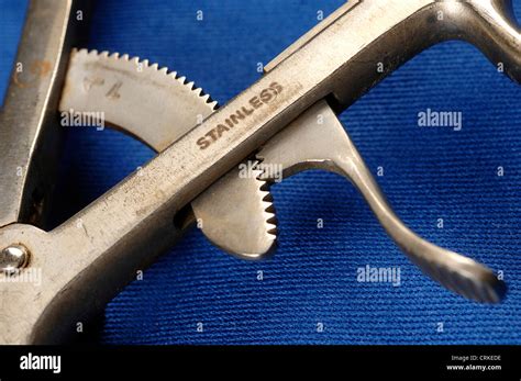 The ratchet mechanism of self-retaining Travers forceps Stock Photo - Alamy
