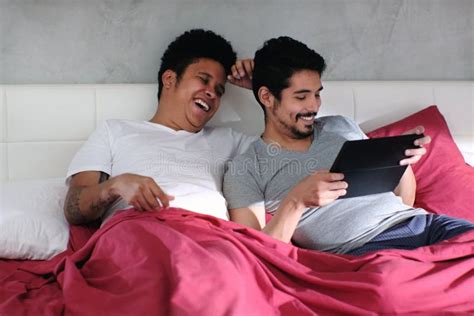 Gay Man Playing Video With Partner In Bed Stock Image Image Of Playing Lgbt