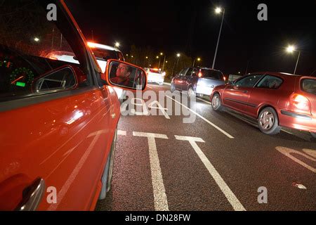 A Driver Stuck In A Traffic Jam On A Busy Road At Night Stock Photo Alamy