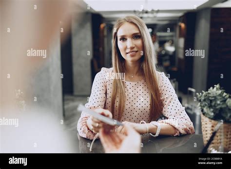 Blonde Woman Hotel Guest Checking In At Front Desk In Hotel Stock Photo Alamy