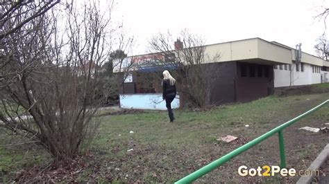 A Pretty Blonde Pulls Down Her Trousers To Pee