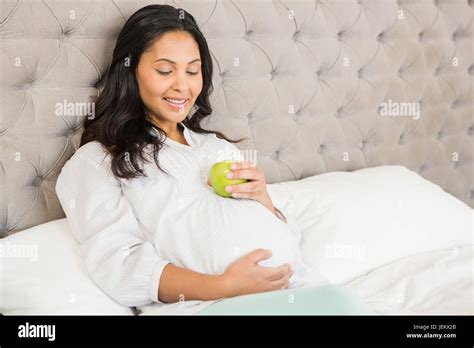 Pregnant Brunette Holding Apple Stock Photo Alamy