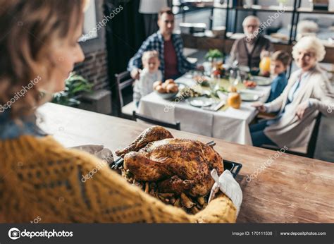 Woman With Thanksgiving Turkey — Stock Photo © Arturverkhovetskiy