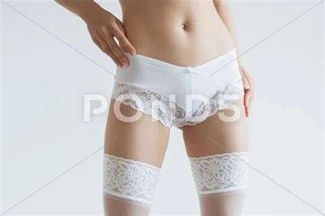 Sexy Woman In A White Lingerie On The Background Premium Photo