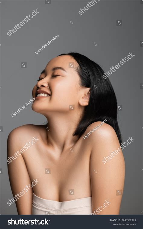 Pleased Asian Woman Naked Shoulders Closed Stock Photo 2248952373 Shutterstock