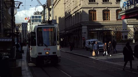 GENEVA, SWITZERLAND - FEBRUARY 20, 2024. Tram and People in Geneva Old