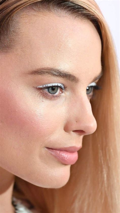 Close Up Portrait Of A Woman With Long Blonde Hair And Blue Eyeshadow