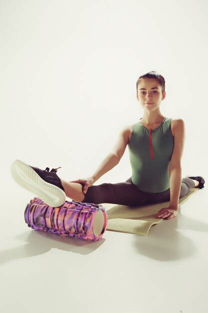 Free Photo Beautiful Slim Brunette Doing Some Stretching Exercises In A Gym