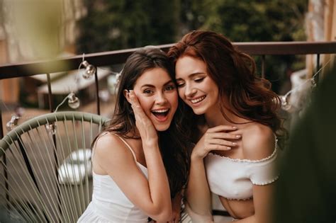 Free Photo Surprised Lovely Brunette Woman Looks Into Camera