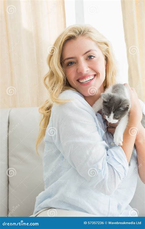 Pretty Blonde With Pet Kitten On Sofa Stock Photo Image Of Clothing Household