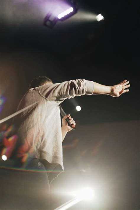 Man Holding Microphone Photo Free Human Image On Unsplash