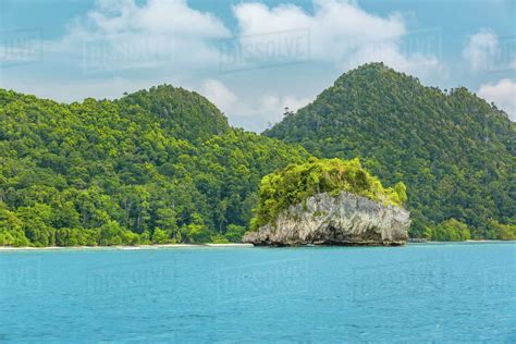 Indonesia Strait Between The Islands Day Coast With Jungle And Small