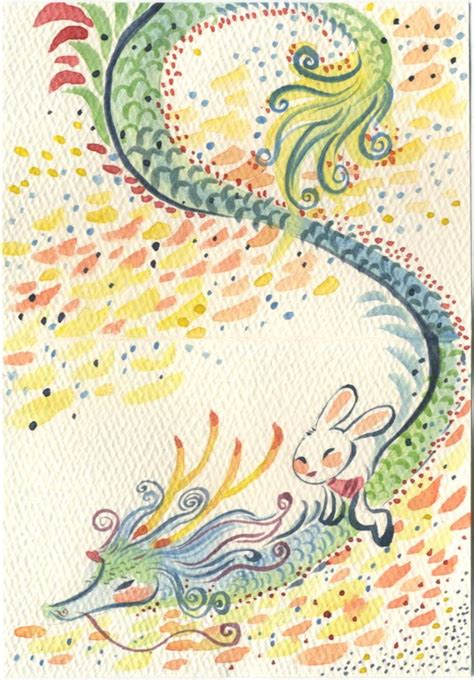 A Card With An Image Of A Dragon And A Rabbit On It S Back