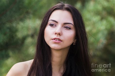 Graceful Charming Brunette Model Posing In Black Dress In Coniferous Park Photograph By