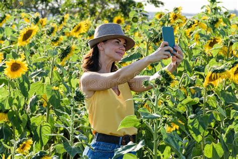 40 Years Old Brazilian Woman With Hat And Sunglasses Taking A Self