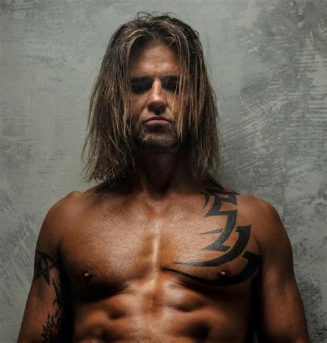 Free Photo Portrait Of Handsome Long Haired Man With Naked Torso Isolated On Gray Background