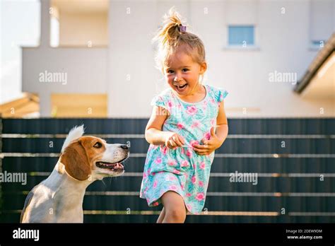 Child Running After Dog Hi Res Stock Photography And Images Alamy
