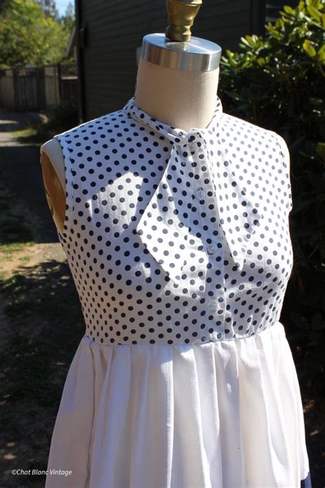 Fashionland Navy Polka Dot Pussy Bow Detailed Mini Dr Gem