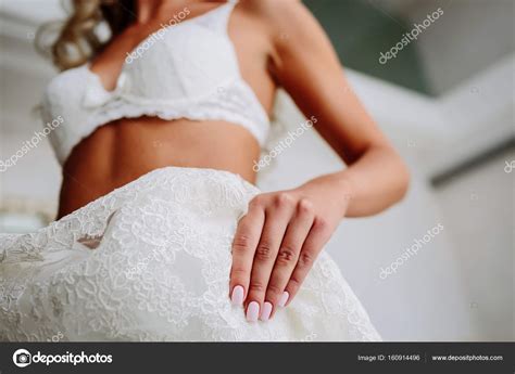 Sexual Bride In White Lace Lingerie Is Putting On Her White Wedding Dress Morning Preparation