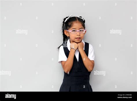 4 Year Old Latin Brunette Girl With Glasses And Uniform Is Ready To Go Back To School Suffering