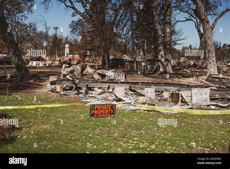 Private Property No Trespassing Sign With Yellow Tape At Burned Park