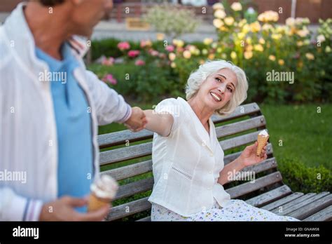 Man Pulls Mature Woman S Hand Stock Photo Alamy