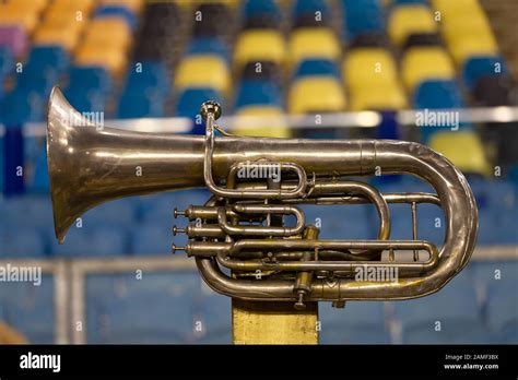 Vintage Copper Trumpet In Front Of A Colorful Background Stock Photo