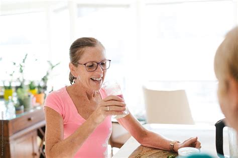 Healthy Mature Women Making Morning Post Run Smoothie Together I By