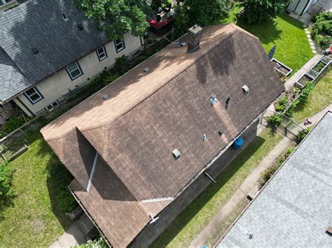 Modern roof and gutters revamp historic home in Minneapolis, MN | Close